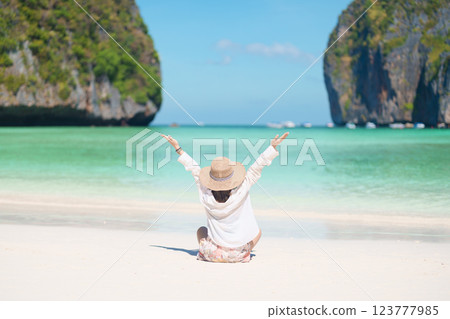 Woman tourist traveling and sightseeing in Krabi, Thailand, happy traveller enjoy at Maya Bay beach on Phi Phi island, Popular paradise island, destination, Southeast Asia Travel, vacation and holiday Woman tourist traveling and sightseeing in Krabi, Thailand, happy traveller enjoy at Maya Bay beach on Phi Phi island, Popular paradise island, destination, Southeast Asia Travel, vacation and holiday 123777985