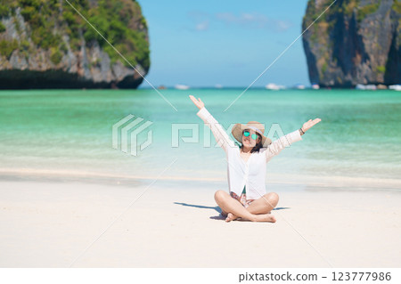 Woman tourist traveling and sightseeing in Krabi, Thailand, happy traveller enjoy at Maya Bay beach on Phi Phi island, Popular paradise island, destination, Southeast Asia Travel, vacation and holiday Woman tourist traveling and sightseeing in Krabi, Thailand, happy traveller enjoy at Maya Bay beach on Phi Phi island, Popular paradise island, destination, Southeast Asia Travel, vacation and holiday 123777986