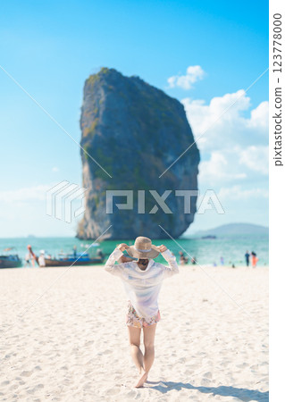Woman tourist traveling and sightseeing in Krabi, Thailand. happy traveller enjoy on beach at Koh Poda island. summer trip, destination, Southeast Asia Travel, vacation and holiday concept Woman tourist traveling and sightseeing in Krabi, Thailand. happy traveller enjoy on beach at Koh Poda island. summer trip, destination, Southeast Asia Travel, vacation and holiday concept 123778000