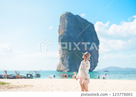 Woman tourist traveling and sightseeing in Krabi, Thailand. happy traveller enjoy on beach at Koh Poda island. summer trip, destination, Southeast Asia Travel, vacation and holiday concept Woman tourist traveling and sightseeing in Krabi, Thailand. happy traveller enjoy on beach at Koh Poda island. summer trip, destination, Southeast Asia Travel, vacation and holiday concept 123778001