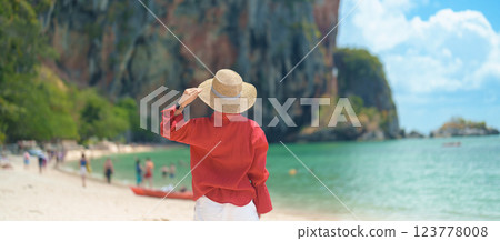 Woman tourist travel and sightseeing in Krabi, Thailand. happy traveller enjoy on beach at Phra nang Cave Beach near Railay Beach. summer trip, destination, Southeast Asia Travel and vacation concept 123778008