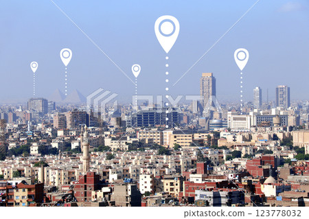 Planning a tourist trip. Top view of Cairo with Great Pyramids and location pin. Travel way,  find trip, point navigation concept. Global positioning system pin map. Modern travel, sightsee, tourism 123778032