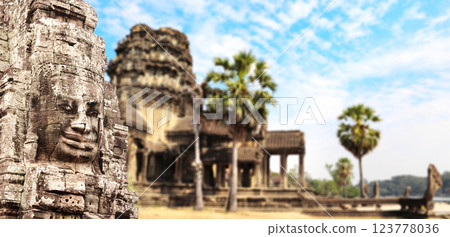 Horizontal banner with stone face in Prasat Bayon Temple. Famous landmark Angkor Wat complex, khmer culture, Siem Reap, Cambodia. Topic of vacation, travel, trip abroad on vacation, cruises and tours Horizontal banner with stone face in Prasat Bayon Temple. Famous landmark Angkor Wat complex, khmer culture, Siem Reap, Cambodia. Topic of vacation, travel, trip abroad on vacation, cruises and tours 123778036