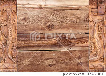 Horizontal background with wood carving frames with traditional moroccan wood carving with animals - crocodile, turtle. Ancient decorative carved border on wooden surface. Copy space for text Horizontal background with wood carving frames with traditional moroccan wood carving with animals - crocodile, turtle. Ancient decorative carved border on wooden surface. Copy space for text 123778041