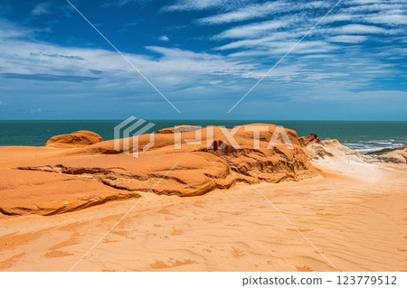 The rock formations at Canoa Quebrada Beach at Canoa Quebrada, state of Ceara, Brazil 123779512