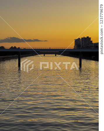 River and bridge at dusk 123779679