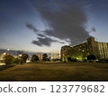 Square and apartment building at dusk 123779682