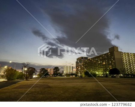 Square and apartment building at dusk 123779682