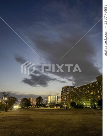 Square and apartment building at dusk 123779683