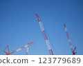 Blue sky and construction site cranes 123779689