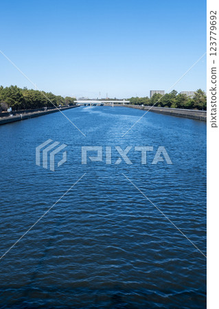 A river near its mouth at high tide 123779692
