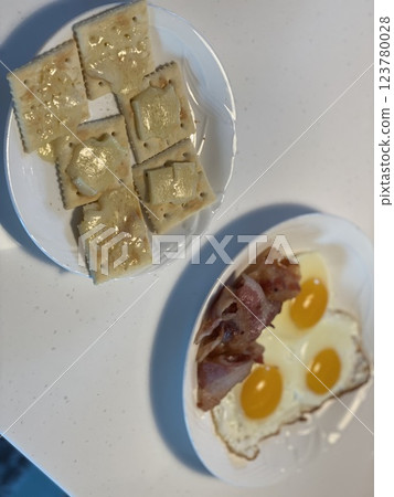 "Runny Egg, Bacon & Cheese Snack: A Savory Treat" "Runny Egg, Bacon & Cheese Snack: A Savory Treat" 123780028