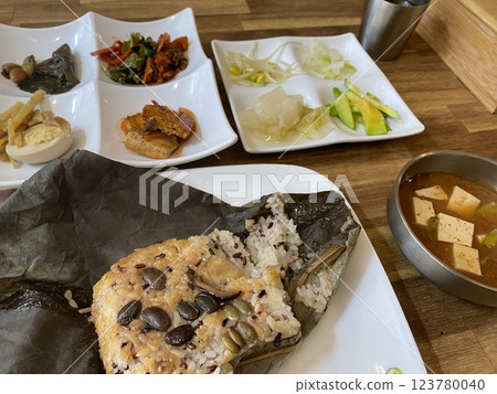 "Fragrant Lotus Leaf Rice: A Traditional Korean Culinary Delight" "Fragrant Lotus Leaf Rice: A Traditional Korean Culinary Delight" 123780040