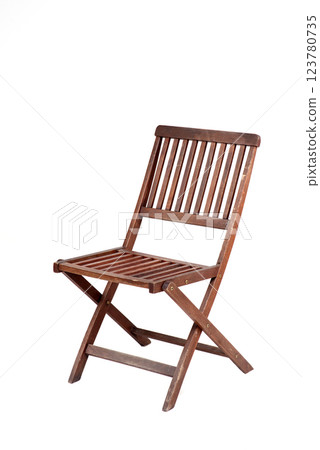 Wooden folding chair isolated on a white background. Vintage rustic furniture with a slatted seat and backrest Wooden folding chair isolated on a white background. Vintage rustic furniture with a slatted seat and backrest 123780735