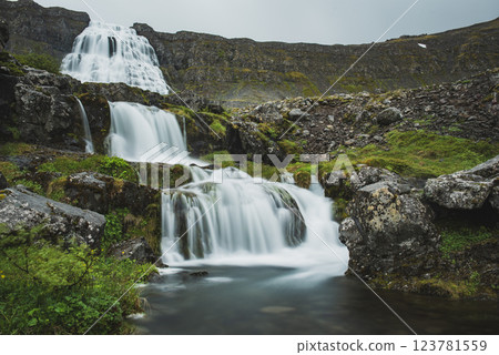 Dynjandi is one the most famous waterfall of the West Fjords of Iceland at summer 123781559