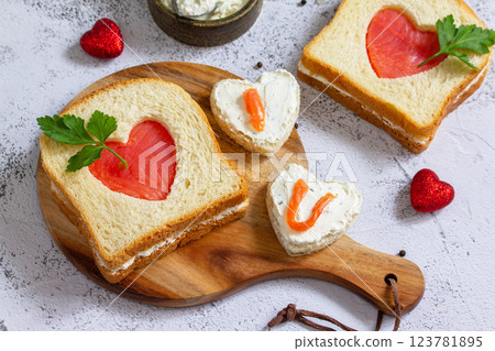 Breakfast for valentine's day or mother's day, toast with salmon and curd cheese with the inscription that I love you. 123781895