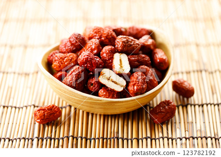 Dried red Chinese dates, jujube in a bowl 123782192