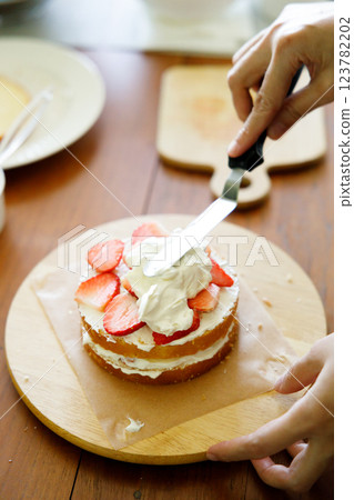 Homemade strawberry shortcake topped with fresh strawberries. 123782202