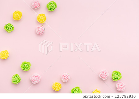 Pastel rosebuds on baby pink background. Versatile Spring Easter-themed composition perfect for backgrounds, greeting cards, social media, and seasonal marketing Pastel rosebuds on baby pink background. Versatile Spring Easter-themed composition perfect for backgrounds, greeting cards, social media, and seasonal marketing 123782936