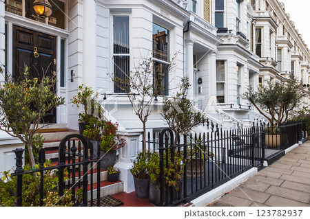 Classic Victorian Townhouses with Ornate Balconies and Lovely Front Gardens 123782937