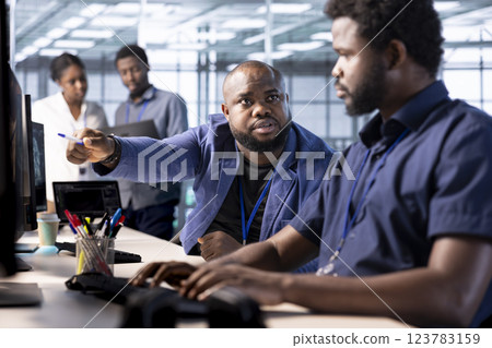 Manager admonishing data center engineer using programming languages to construct algorithms and build applications. Server hub supervisor scolding worker unable to properly optimize code Manager admonishing data center engineer using programming languages to construct algorithms and build applications. Server hub supervisor scolding worker unable to properly optimize code 123783159