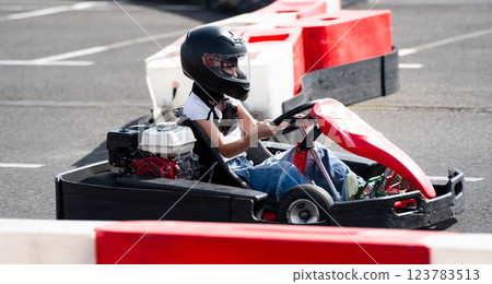 Kid Driving Fast Go Kart By Racing Track, Extreme Entertainment Park 123783513