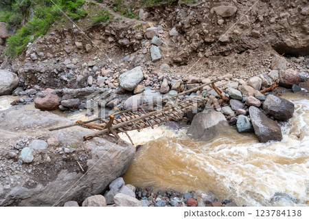 Old bridge crossing the river in Colca Canyon, Peru 123784138