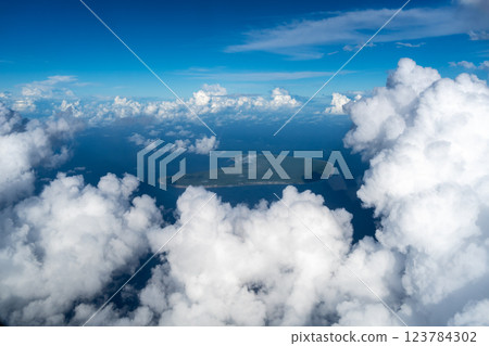 Aerial view of Makatea Island surrounded by clouds in French Polynesia 123784302