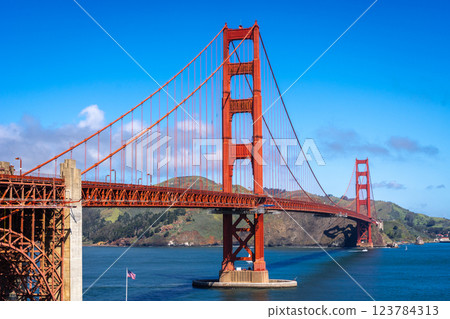 Golden Gate Bridge over blue waters with scenic hills in San Francisco 123784313