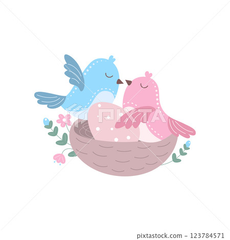 Two birds sit in a nest 123784571