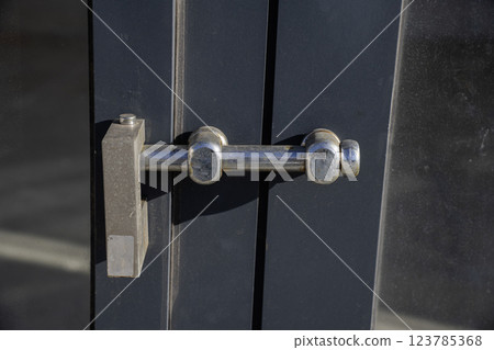 Lock on a warehouse doors Lock on a warehouse doors 123785368