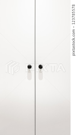 Minimalist white wardrobe with black circular handles and sharp clean lines 123785578