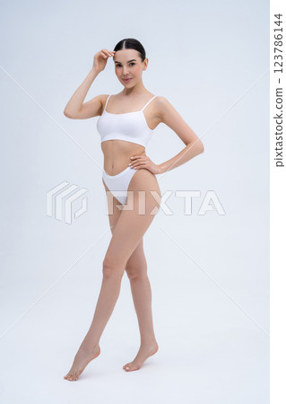 Pretty long-haired young caucasian woman in white underwear 123786144