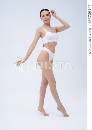 Pretty long-haired young caucasian woman in white underwear 123786145