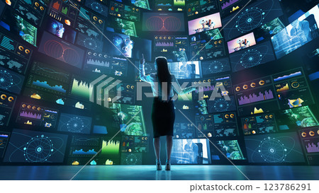 Woman interacting with curved digital screens displaying data analytics, global connections, cybersecurity metrics. 123786291