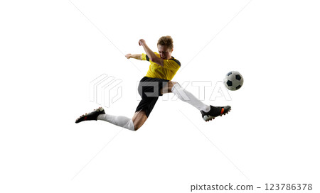 Ambitious of man, soccer player during intensive match, kicking ball mid-air, playing isolated on white background Ambitious of man, soccer player during intensive match, kicking ball mid-air, playing isolated on white background 123786378