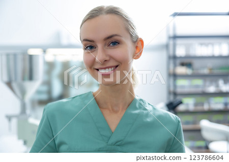Woman scientist standing in research laboratory in professional interior 123786604