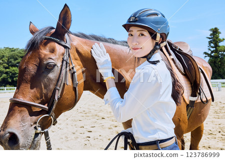 Woman practicing horse riding Woman practicing horse riding 123786999
