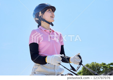 A woman practicing horse riding 123787076