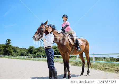 A woman practicing horse riding 123787121