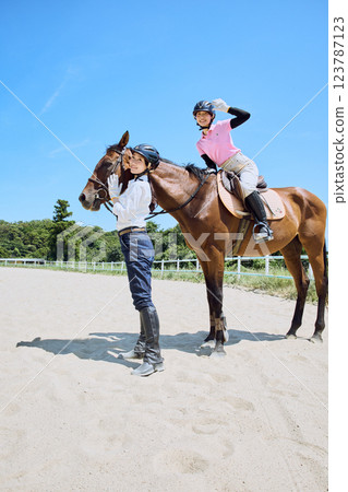 A woman practicing horse riding A woman practicing horse riding 123787123