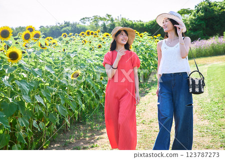 Sunflower field and women Sunflower field and women 123787273
