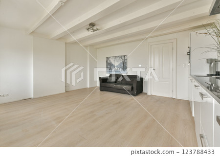 A clean, modern interior showcasing a minimalist living room with soft lighting and neutral tones, ideal for creating a serene atmosphere. A clean, modern interior showcasing a minimalist living room with soft lighting and neutral tones, ideal for creating a serene atmosphere. 123788433