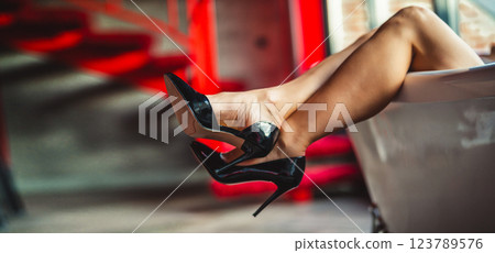 Woman feet high heels shoes in bathrobe at home, closeup 123789576