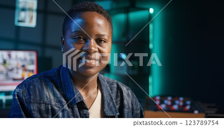 Jolly freelancer noting down ideas on paper using pen while teleworking. Upbeat remote employee working at home office desk, reading information on laptop and writing in notebook, camera B Jolly freelancer noting down ideas on paper using pen while teleworking. Upbeat remote employee working at home office desk, reading information on laptop and writing in notebook, camera B 123789754