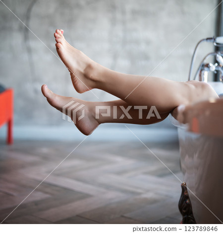 Woman feet in bathrobe at home, closeup Woman feet in bathrobe at home, closeup 123789846