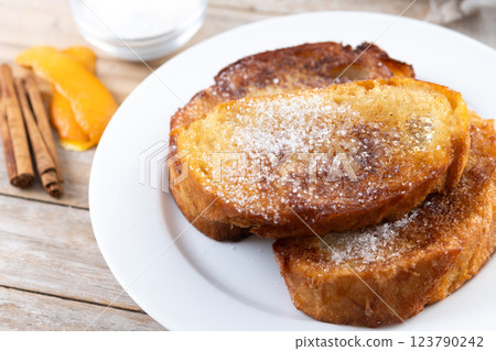 Traditional Spanish torrijas for Holy Week on wooden table. French Toast. 123790242