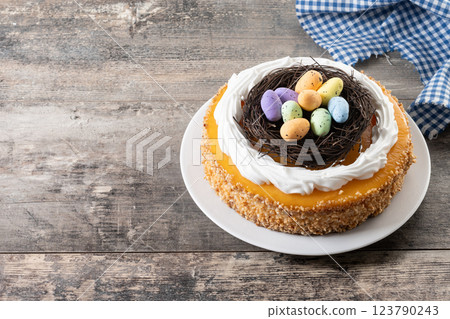 Homemade Easter egg cake on wooden table Homemade Easter egg cake on wooden table 123790243