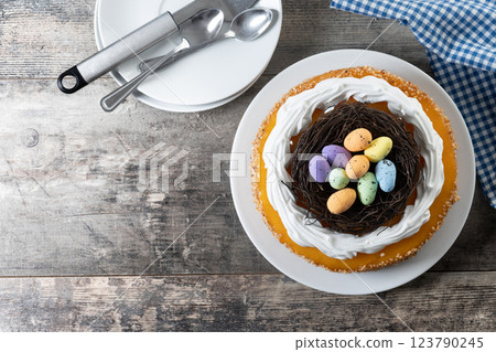 Homemade Easter egg cake on wooden table Homemade Easter egg cake on wooden table 123790245