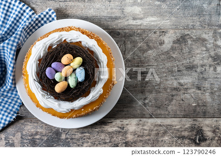 Homemade Easter egg cake on wooden table Homemade Easter egg cake on wooden table 123790246